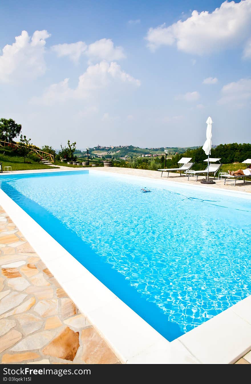 Swimming pool of an Italian beauty farm in the middle vineyards, Monferrato area, Piemonte region. Swimming pool of an Italian beauty farm in the middle vineyards, Monferrato area, Piemonte region.