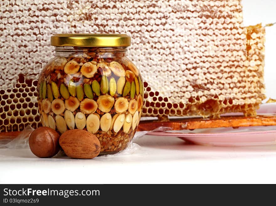 Natural honey in a glass jar