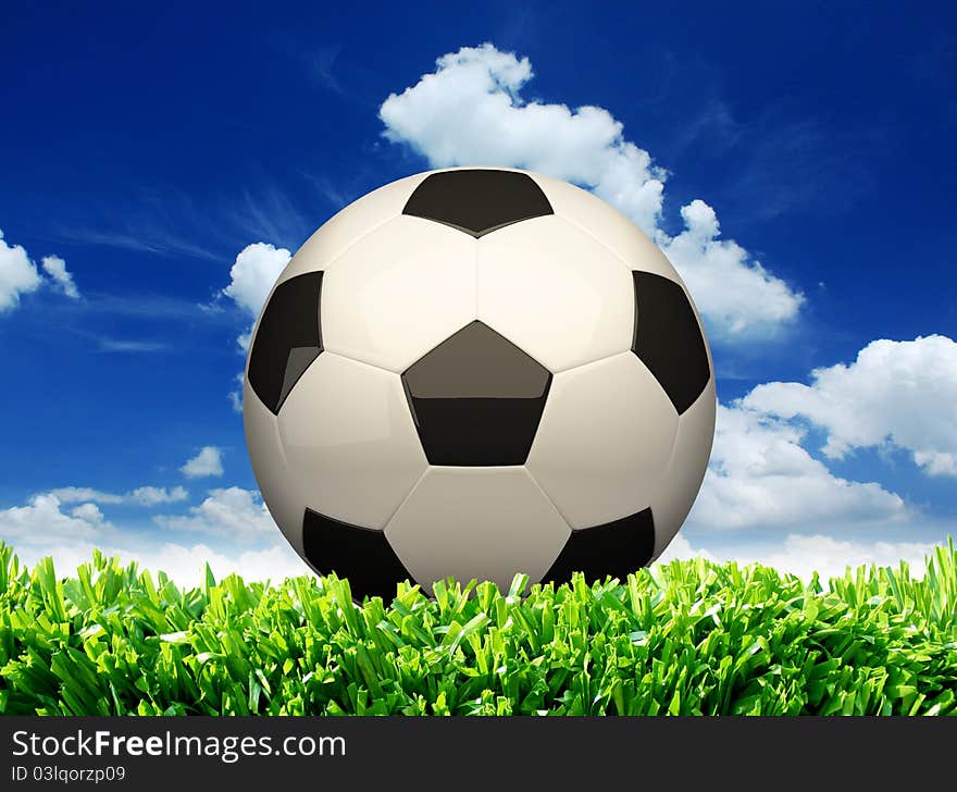 Photo of a football on grass with sky background. Photo of a football on grass with sky background.