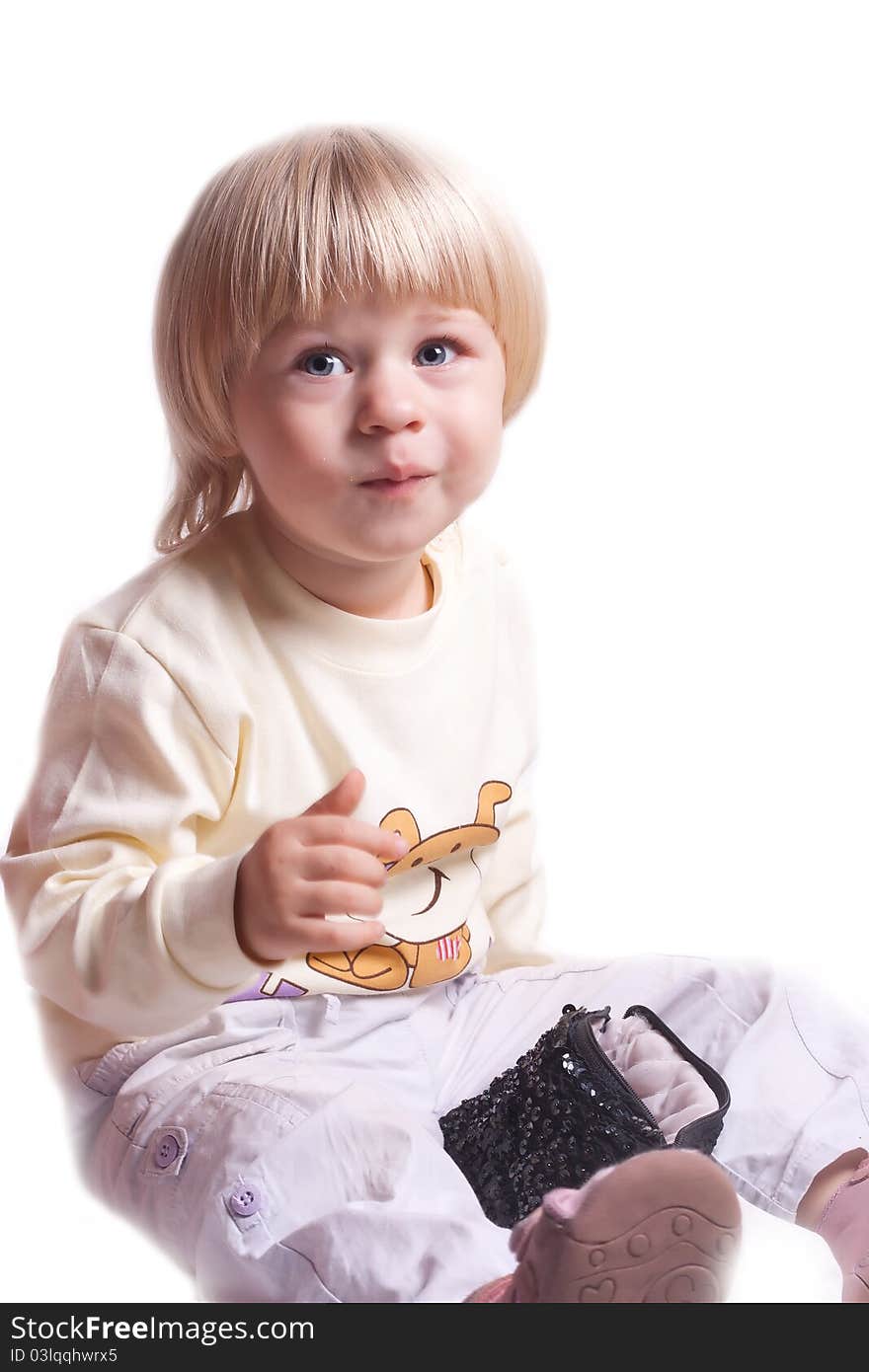 Small girl eating cookies on a white background