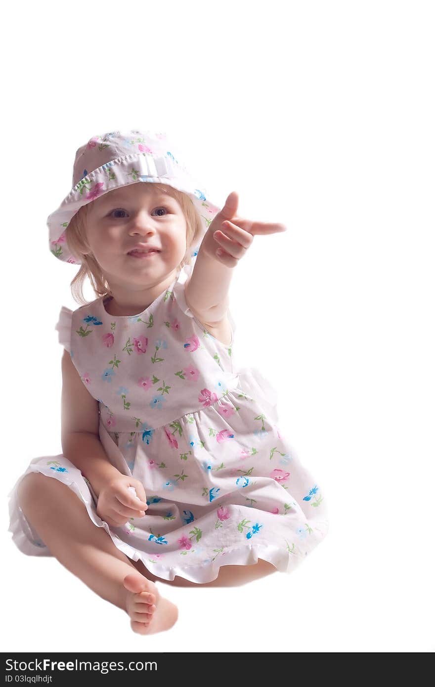 The little girl in a dress with arm outstretched on a white background