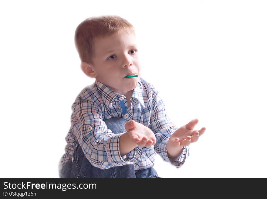 The little boy in a dress with arm outstretched on a white background