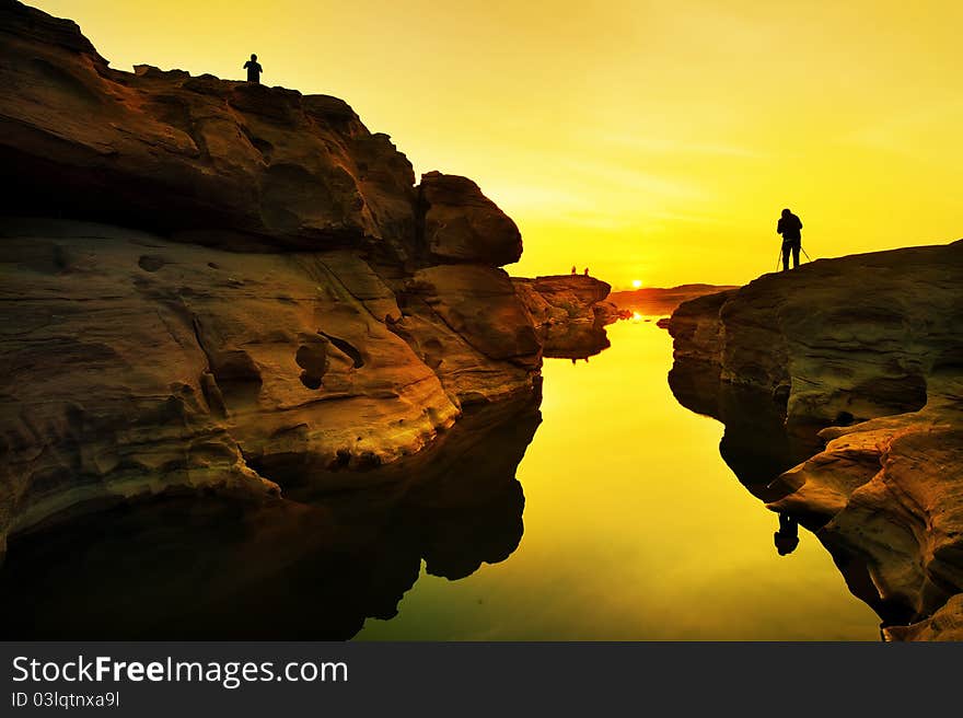 Silhouette of many photographer shooting sunrise