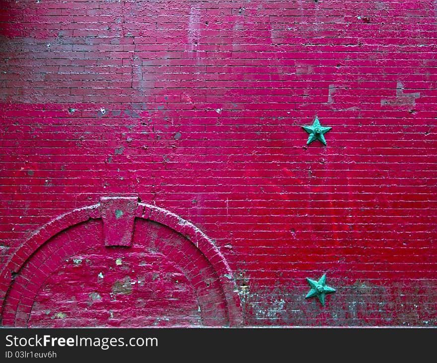 Very old and worn red brick wall in New York City