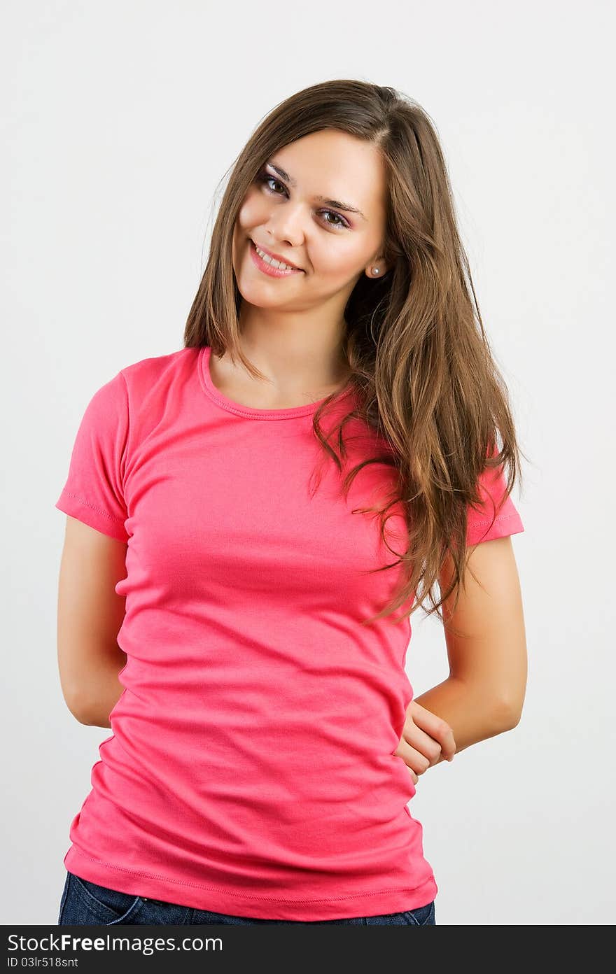 Portrait of a beautiful young woman looking happy against white background