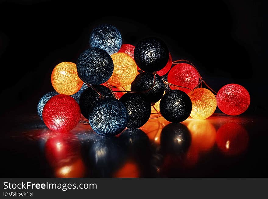 Fabric electric garland on a black background