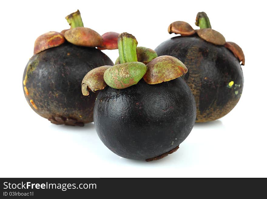 Three mangosteen on white background