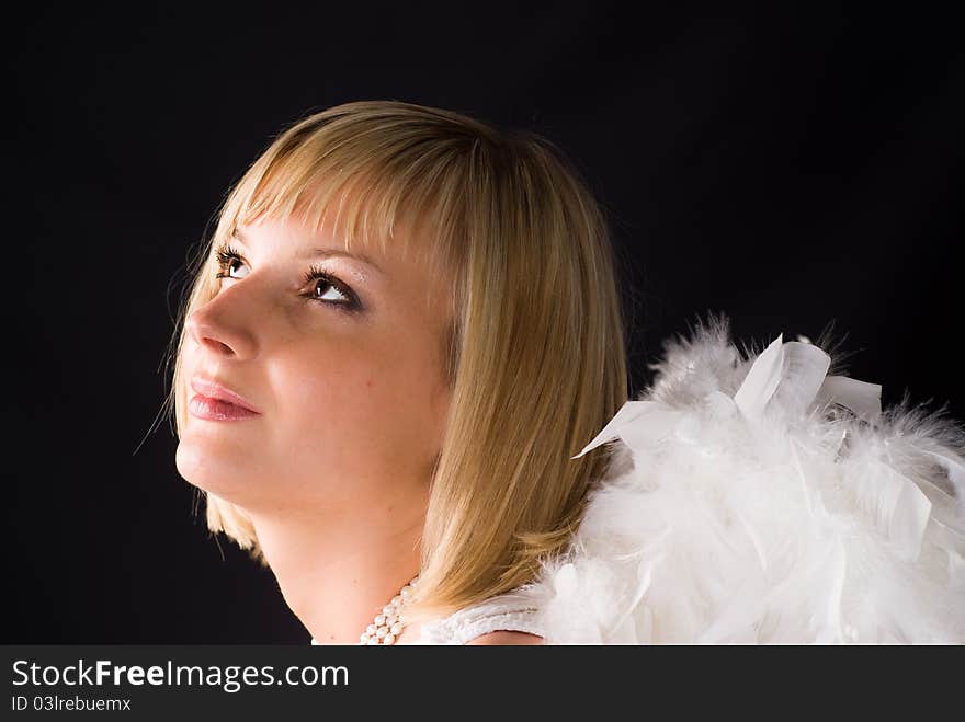 Cute angel dreaming on a black background. Cute angel dreaming on a black background