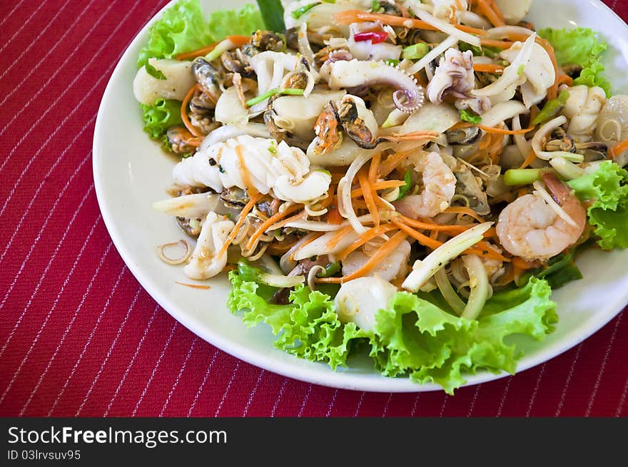 Thai style salad seafood on red back ground