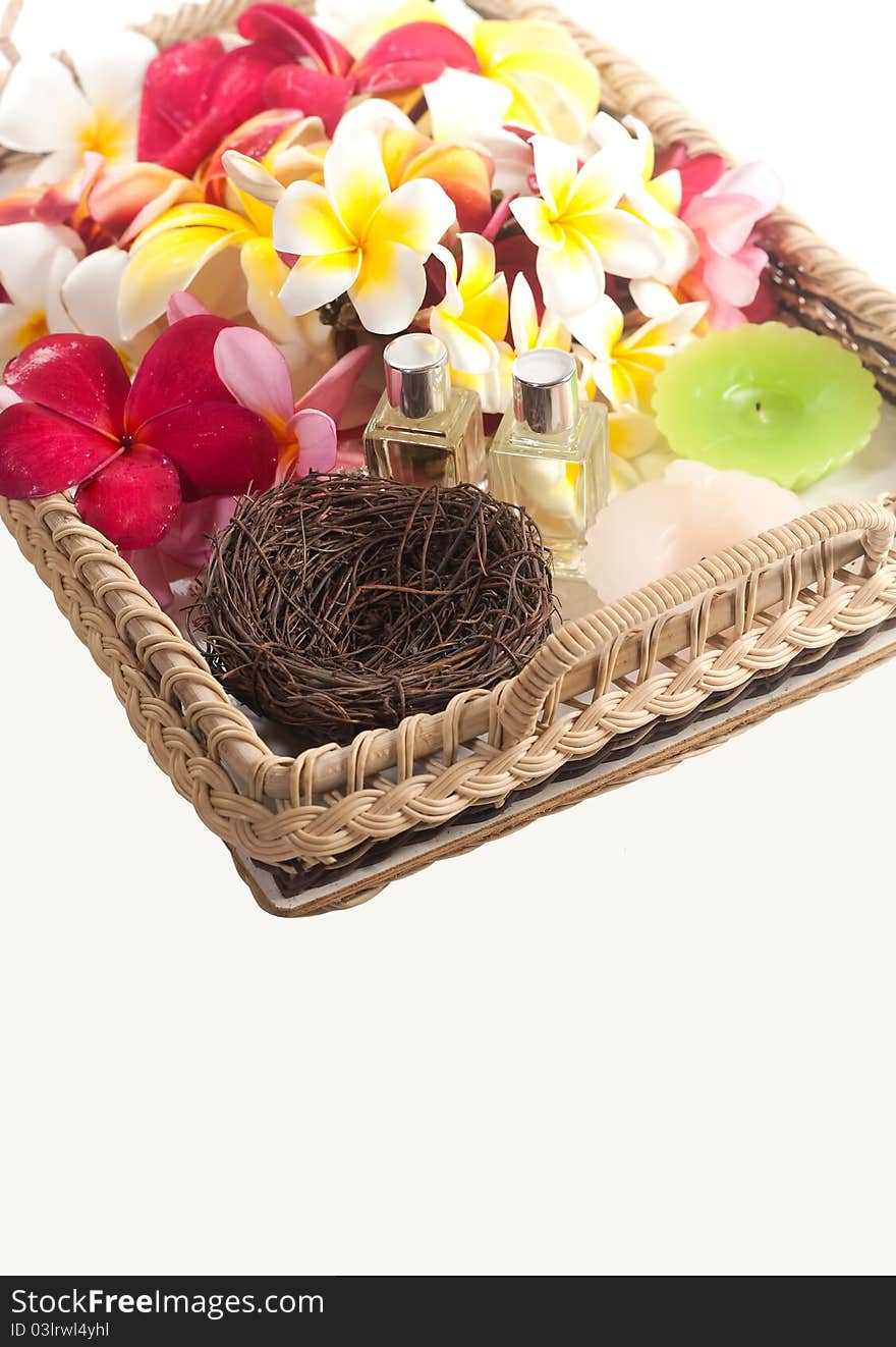 Colorful of plumeria, perfume bottles and candle in tray. Colorful of plumeria, perfume bottles and candle in tray