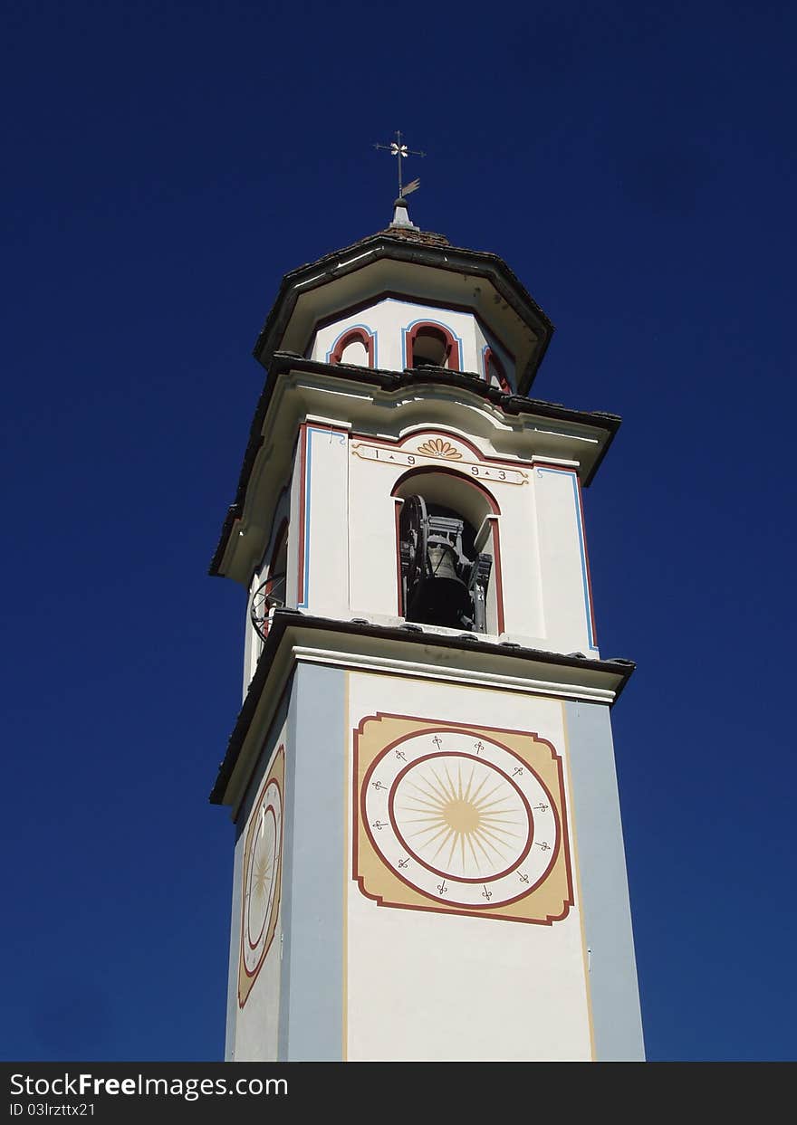 Church tower of the village of Bosco Gurin in the mountains of Switzerland. Church tower of the village of Bosco Gurin in the mountains of Switzerland