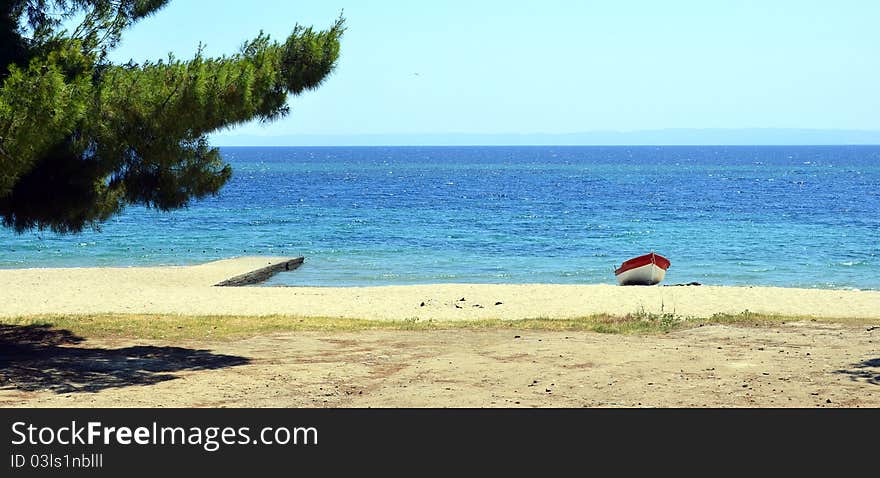 Lonely boat on sunny seaside