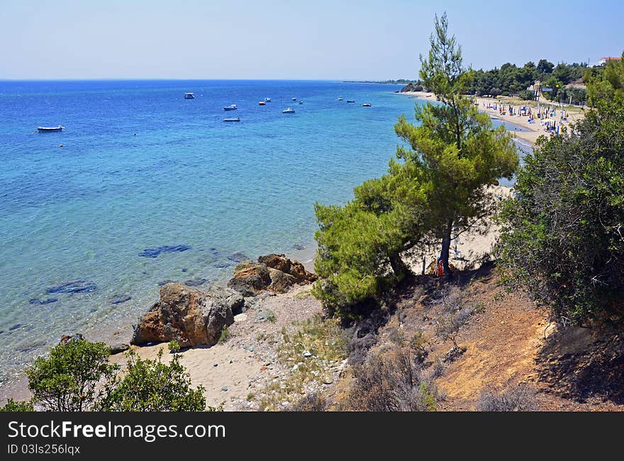 Golf beach with boats in Sithonia peninsula of Halkidiki in Greece. Golf beach with boats in Sithonia peninsula of Halkidiki in Greece