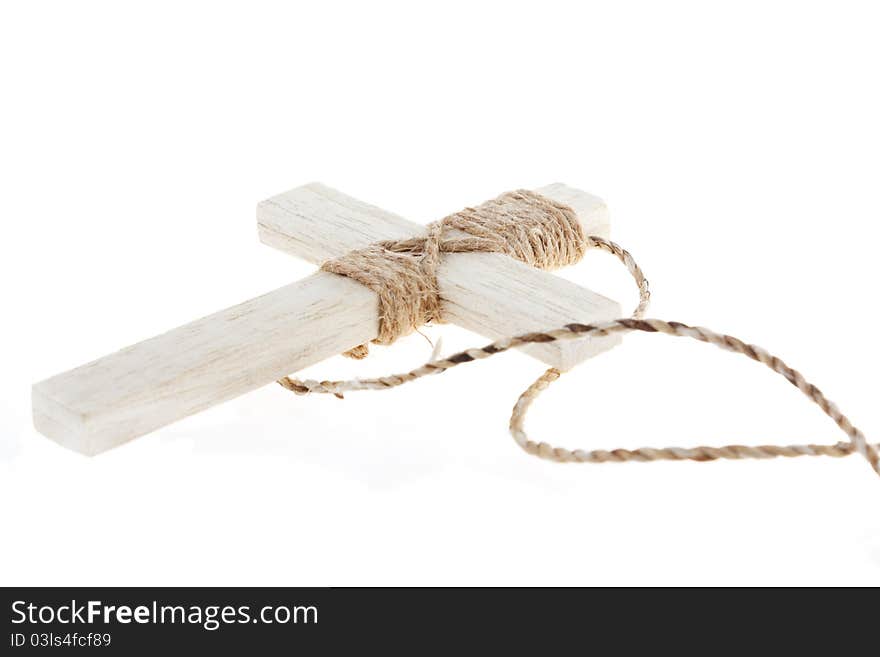 Wooden antique look crucifix necklace isolated on white background