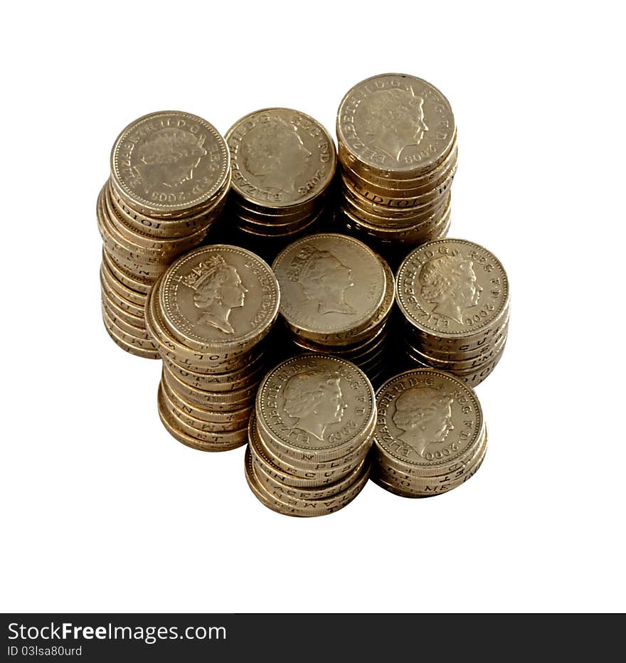 British pound coins arranged in piles. British pound coins arranged in piles