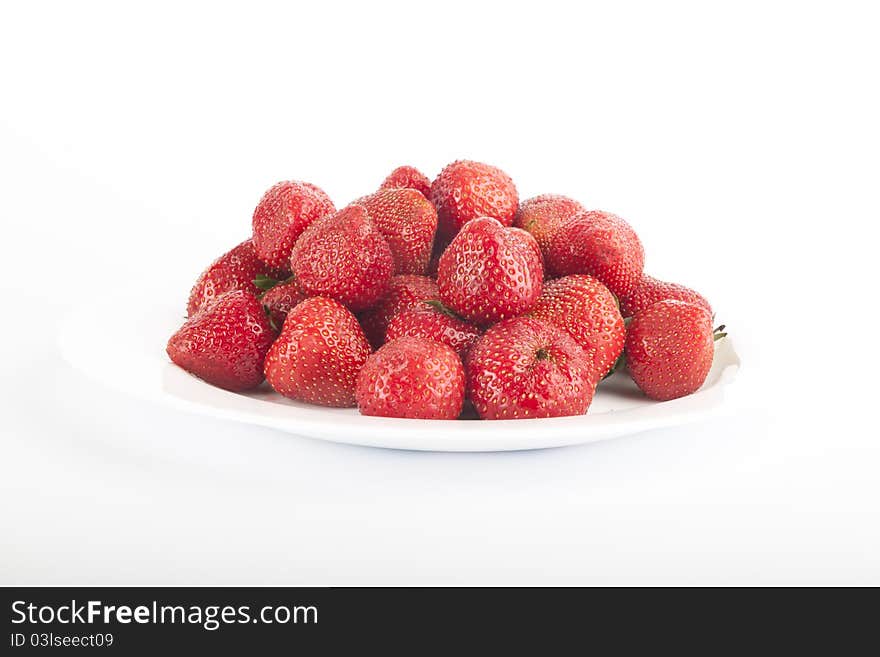 Ripe strawberries on white background