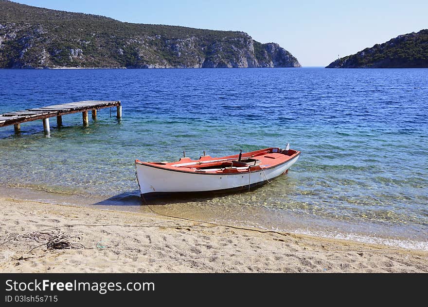 Boat And Wooden Bridge