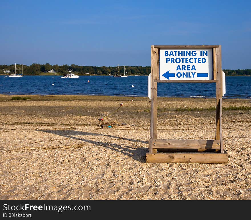 Sign instructing bathers at the beach where to swim. Sign instructing bathers at the beach where to swim