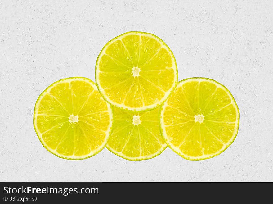 Four slices of lemons isolated on canvas background. Four slices of lemons isolated on canvas background.