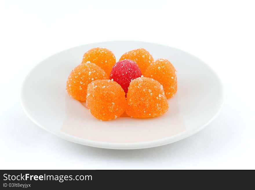 A marmalade on a saucer isolated on white