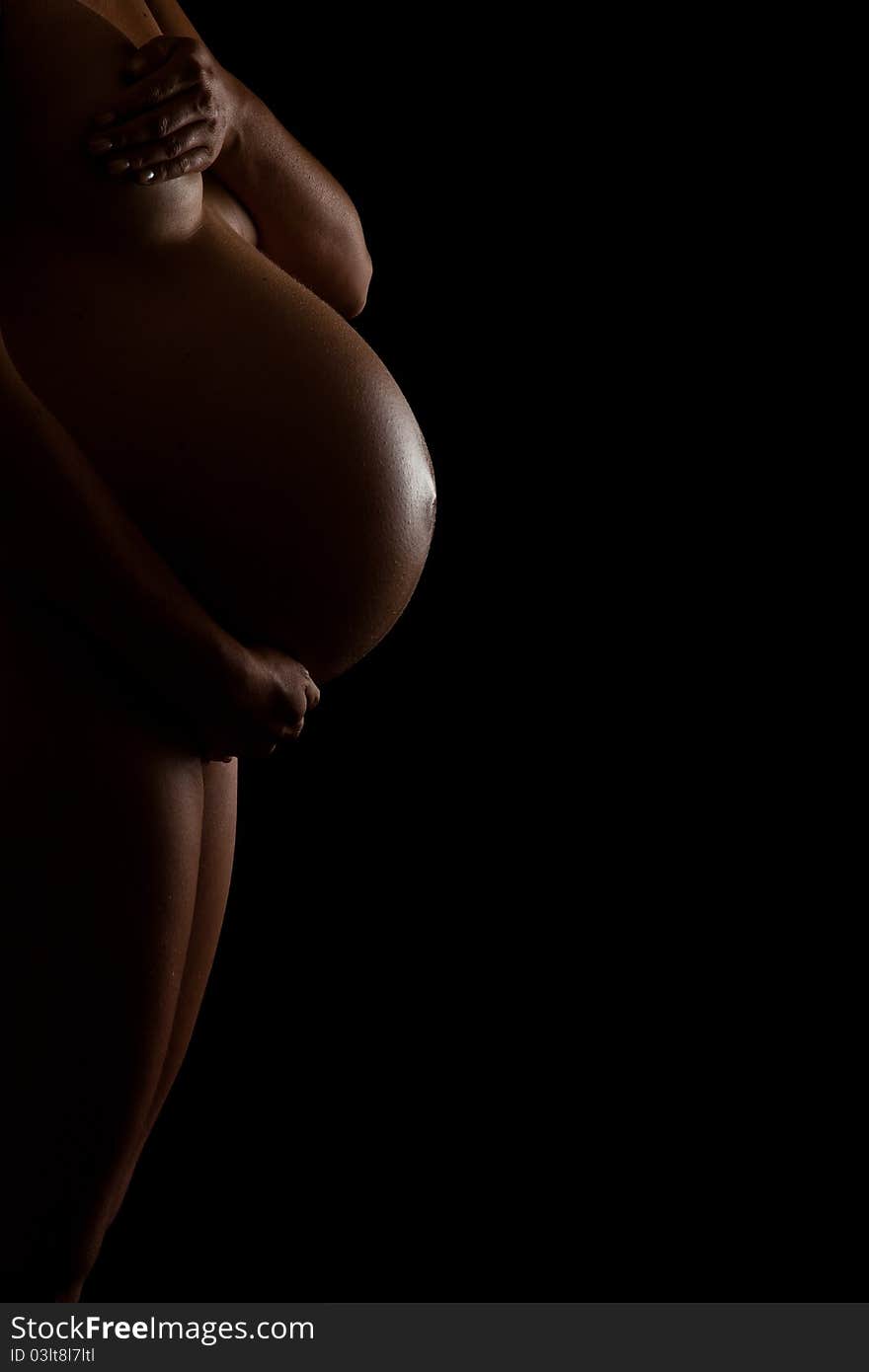 Nude pregnant woman belly