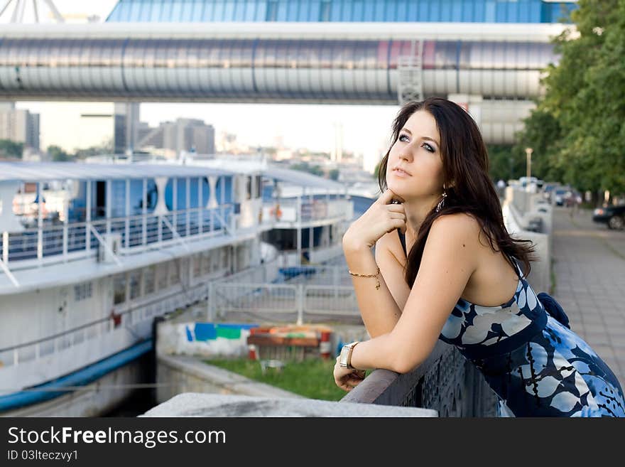 Girl Walking On Embankment