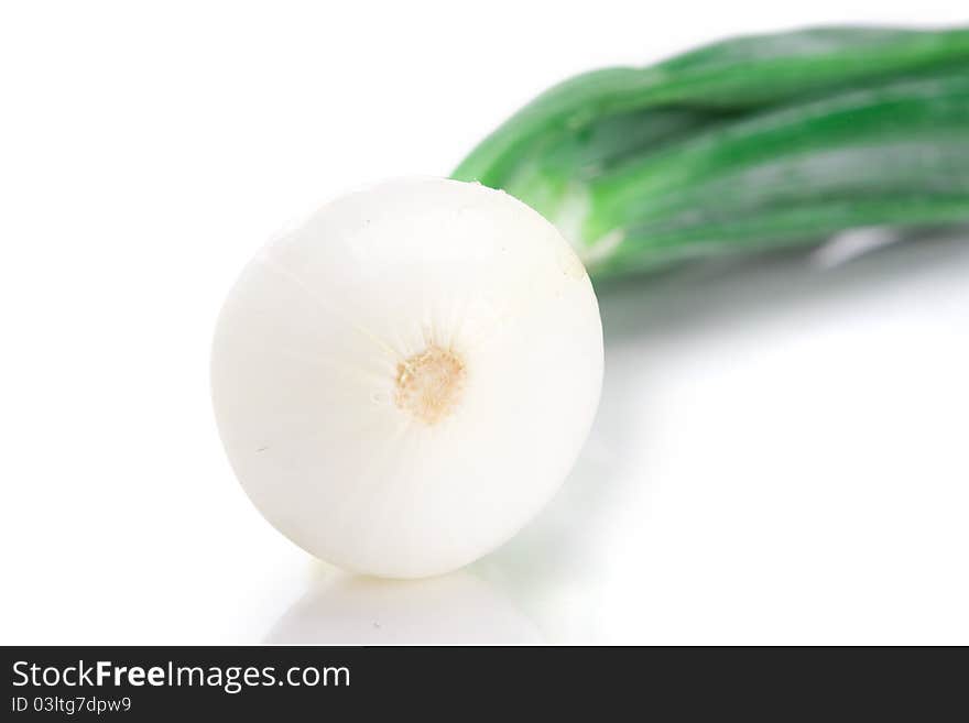 A single stalk of spring onion over white background.