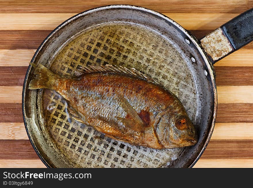 Roasted fish on fried pan