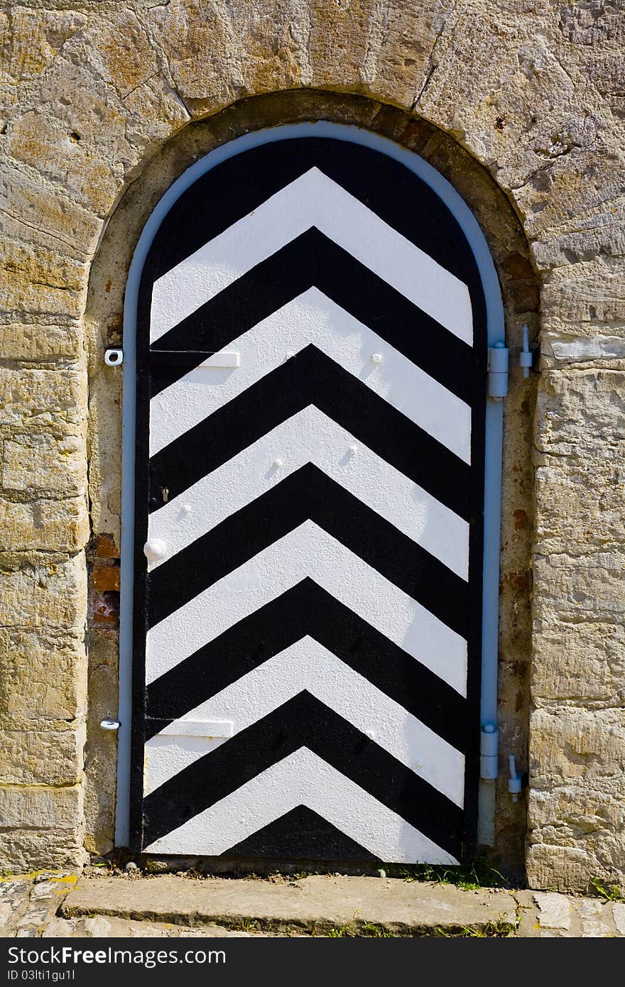 Black and white door leading to ...