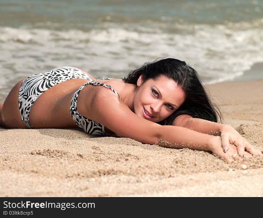 Woman Lying On Beach