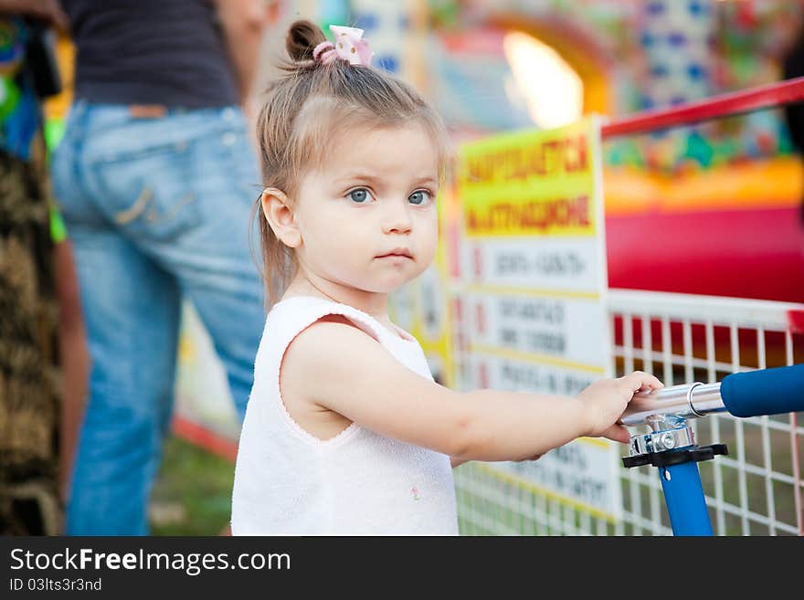 Happy child jumping on trampoline outdoors