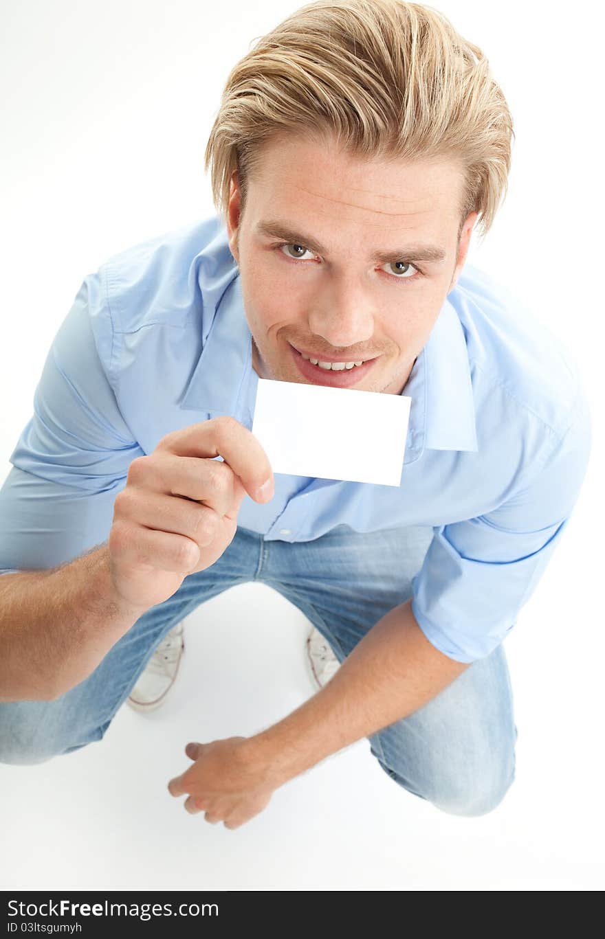 Happy blond man with giving card isolated on white