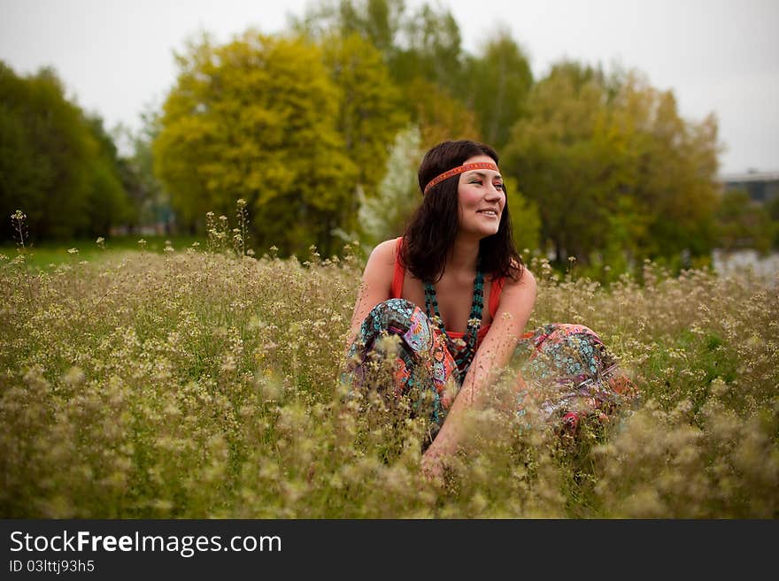 Woman sitting in the grass. Woman sitting in the grass