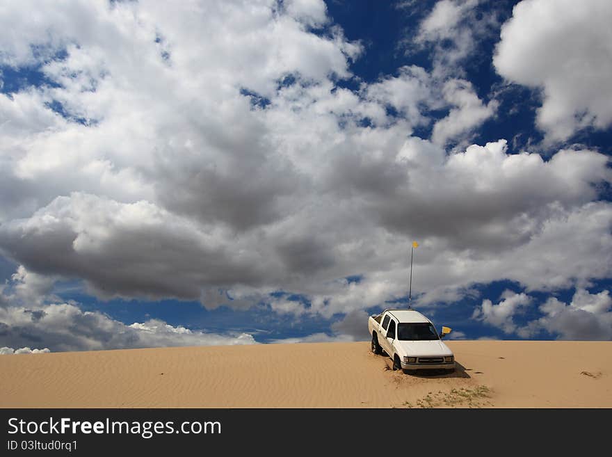 A pick-up is exploring in desert. A pick-up is exploring in desert