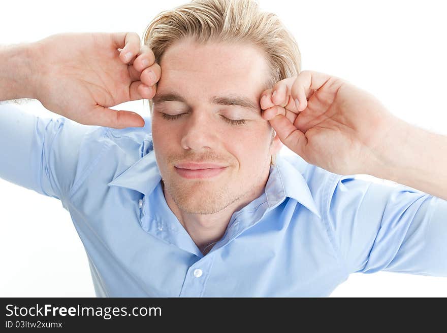 Young blond man holding his head. Young blond man holding his head