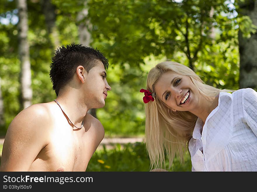 Fashionable romantic young couple outdoors in the park.