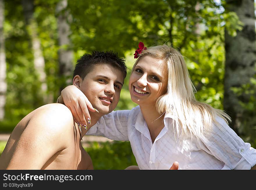 Fashionable romantic young couple outdoors in the park.