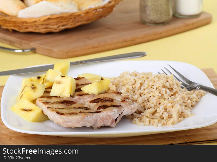 Grilled pork loin and pineapple with rice. Grilled pork loin and pineapple with rice