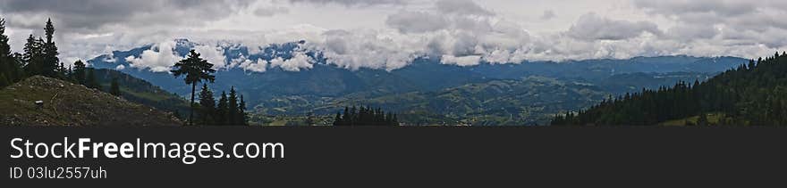 Panorama background in Carpathians. Beautiful montains and landscape in Romania.