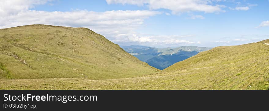 Panorama background in Carpathians. Beautiful montains and landscape in Romania.