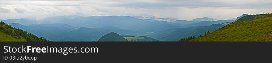 Panorama background in Carpathians. Beautiful montains and landscape in Romania.