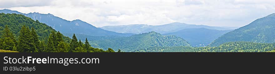 Panorama background in Carpathians. Beautiful montains and landscape in Romania.