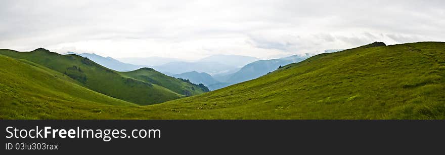 Panorama background in Carpathians. Beautiful montains and landscape in Romania.