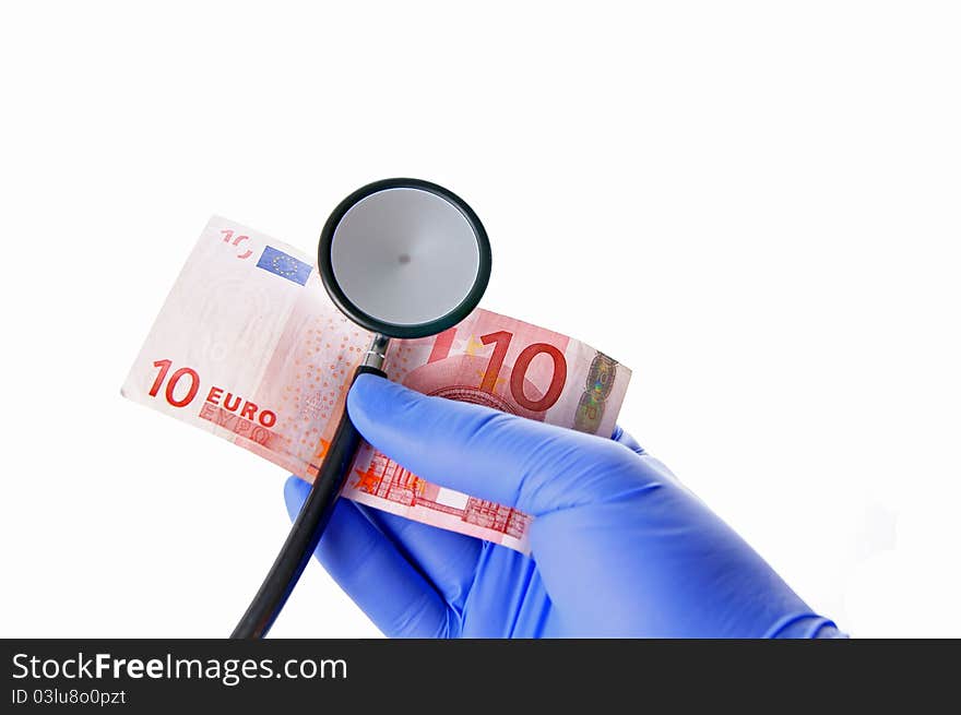 A hand with stethoscope and ten euro. A hand with stethoscope and ten euro