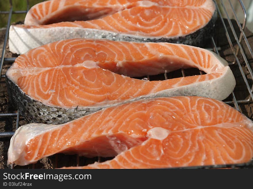 Pieces of salmon for cooking steaks on the grill. Pieces of salmon for cooking steaks on the grill