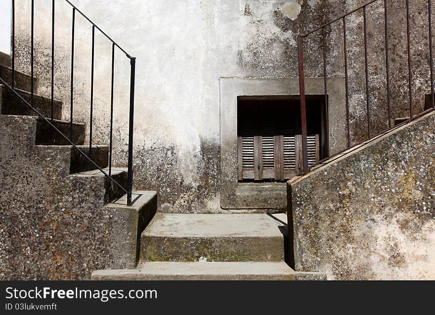 Two concrete stairways with steel handle bars going left and right. Two concrete stairways with steel handle bars going left and right