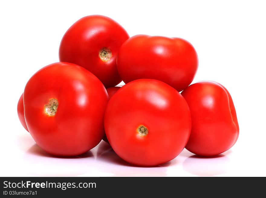 Color photo of red tomatoes on white. Color photo of red tomatoes on white