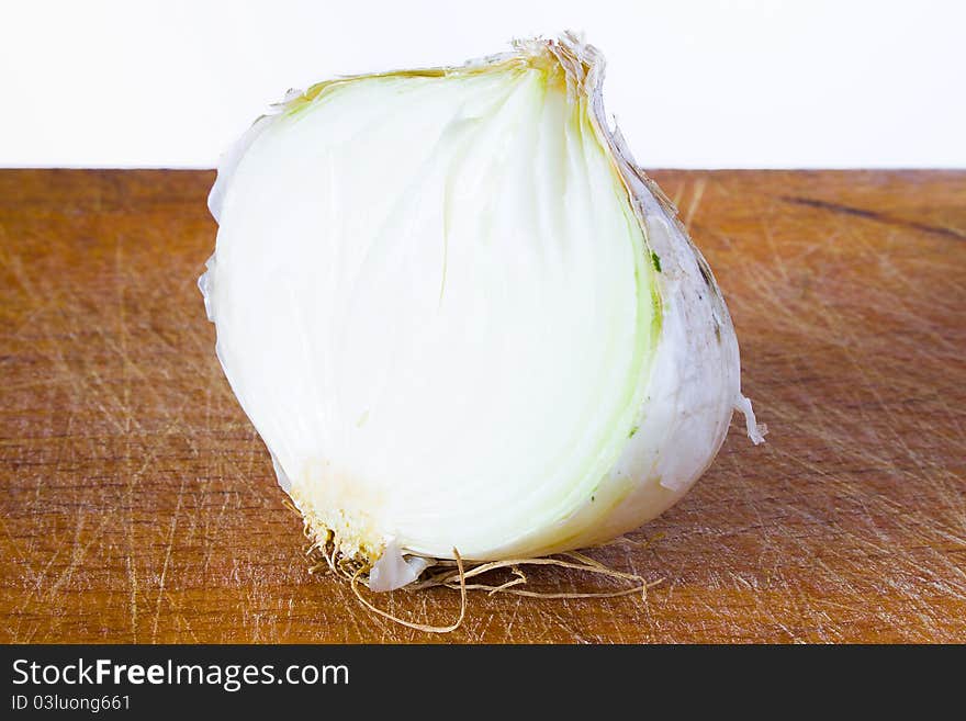 Closeup of half bulb of onion on the table