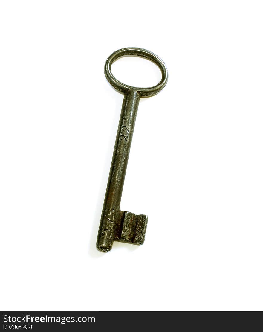 Old key isolated on white