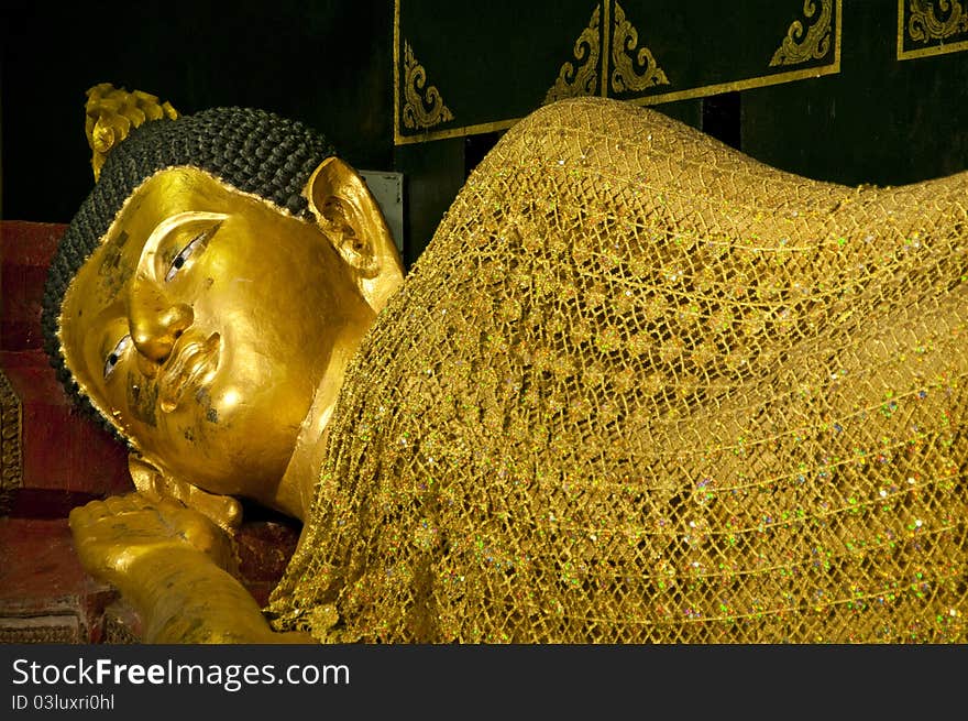 Golden buddha in sleeping posture